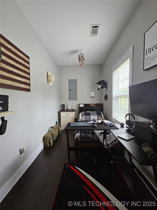 office space with hardwood / wood-style flooring and electric panel