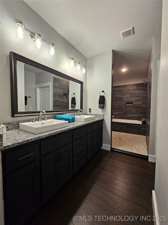 bathroom featuring hardwood / wood-style flooring and vanity