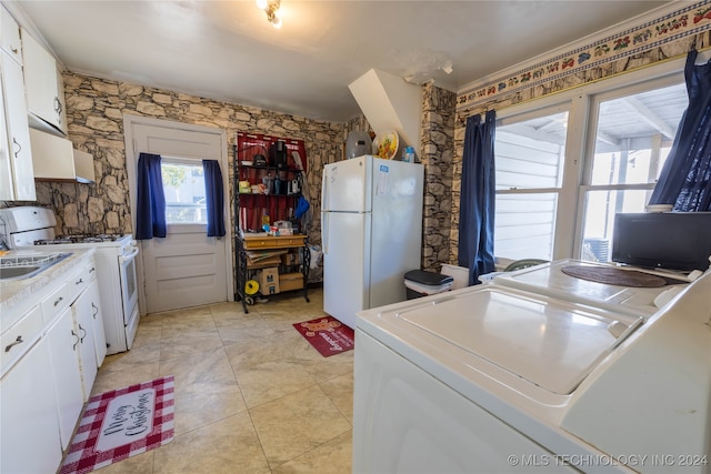 kitchen featuring white cabinetry, white appliances, and light tile patterned floors