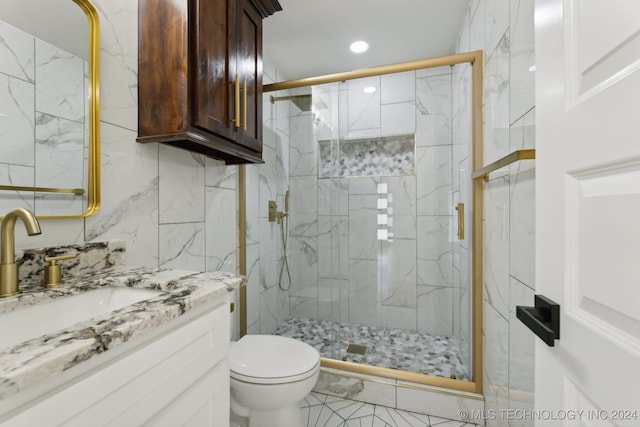 bathroom with tile patterned flooring, vanity, an enclosed shower, and toilet