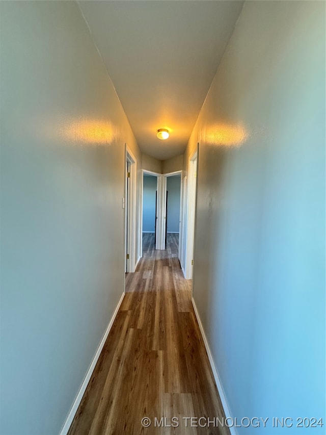 hallway featuring hardwood / wood-style floors