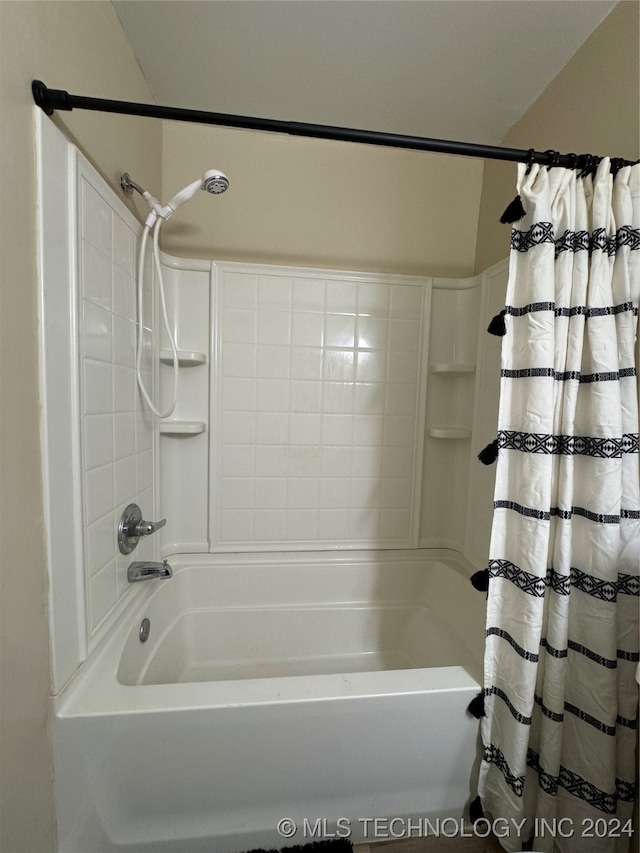 bathroom featuring shower / bath combo with shower curtain