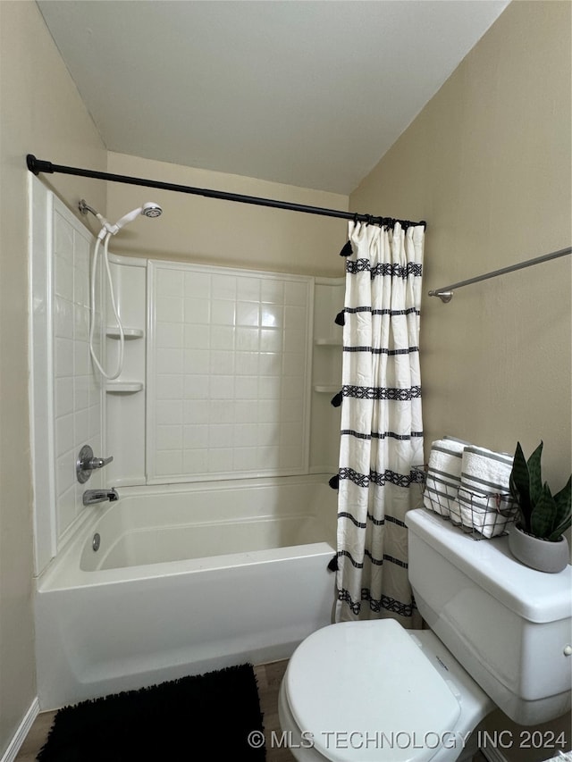 bathroom featuring toilet and shower / bathtub combination with curtain