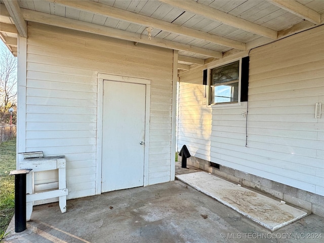 property entrance featuring a patio area