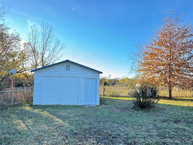 garage with a lawn