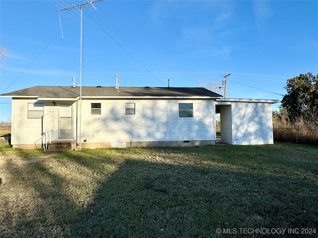 back of house with a yard