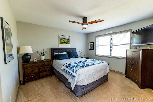 bedroom featuring ceiling fan and light colored carpet