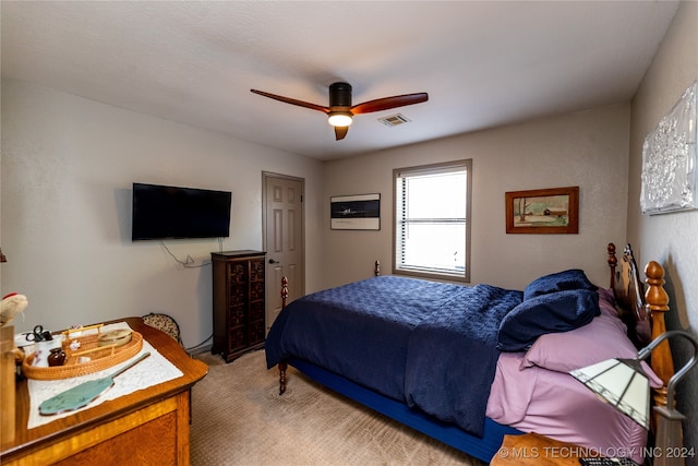 bedroom featuring ceiling fan and light colored carpet