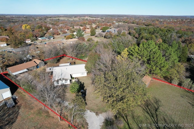 bird's eye view featuring a forest view