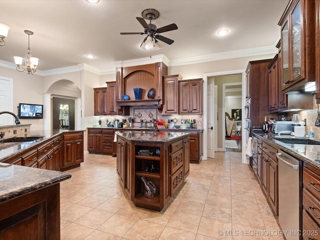 kitchen featuring sink, dishwasher, hanging light fixtures, dark brown cabinetry, and a kitchen island