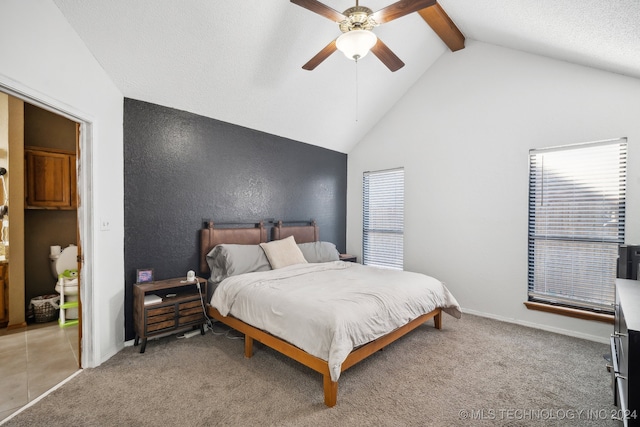 carpeted bedroom featuring ceiling fan and lofted ceiling with beams