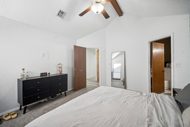 carpeted bedroom with high vaulted ceiling, ceiling fan, a textured ceiling, connected bathroom, and beamed ceiling