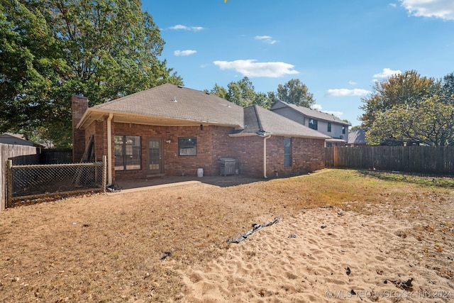 rear view of house featuring a patio area