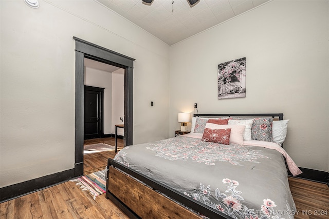 bedroom featuring hardwood / wood-style floors and ceiling fan