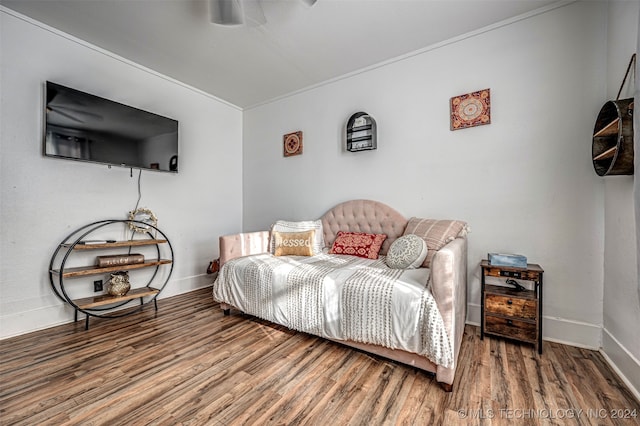 bedroom with hardwood / wood-style flooring and ceiling fan