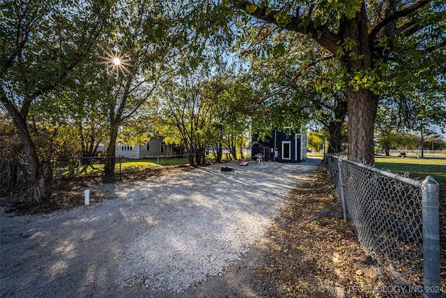 view of property hidden behind natural elements