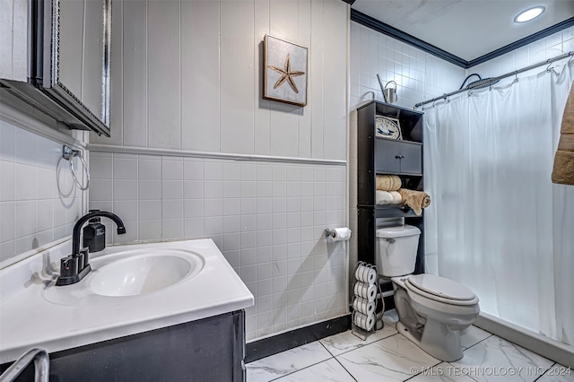 bathroom with a shower with curtain, vanity, crown molding, tile walls, and toilet