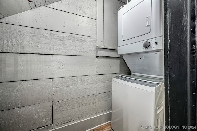 washroom featuring stacked washer and dryer