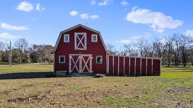 view of outdoor structure with a lawn