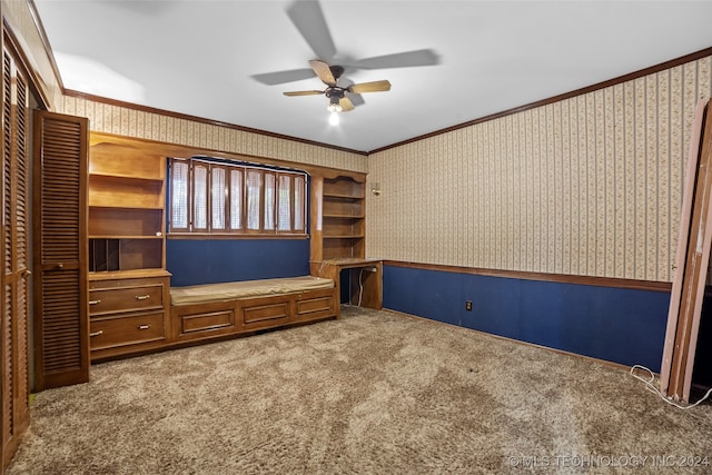 interior space featuring carpet flooring, crown molding, and ceiling fan