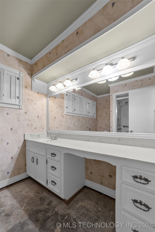 bathroom with crown molding and vanity