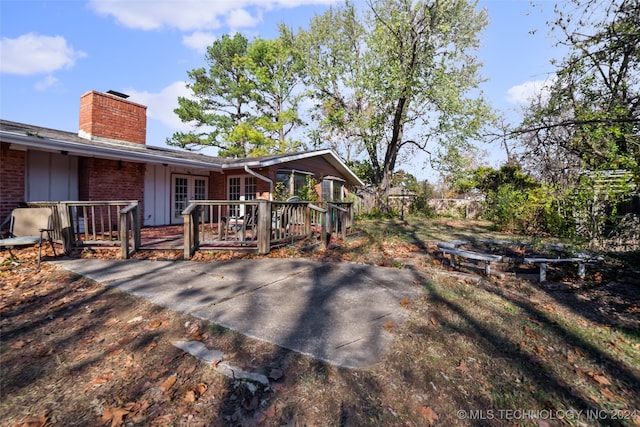 back of property with a wooden deck