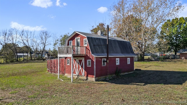 view of property exterior featuring a lawn