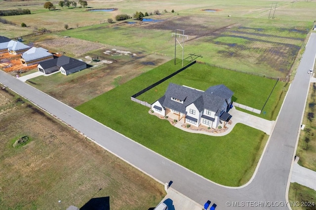 birds eye view of property featuring a rural view