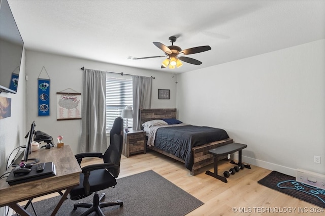 bedroom featuring ceiling fan and light hardwood / wood-style flooring