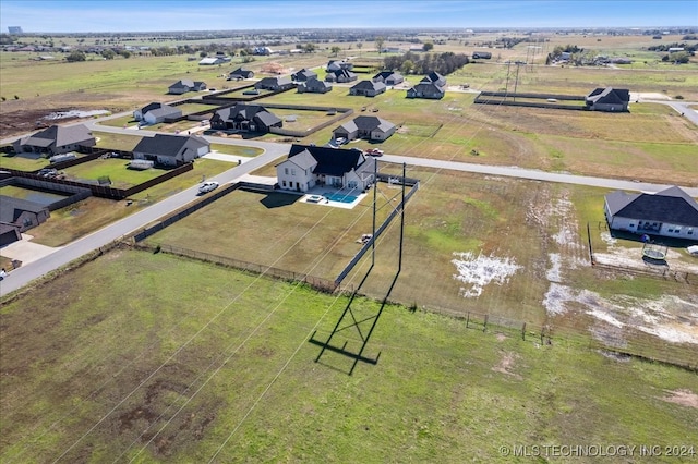 birds eye view of property with a rural view