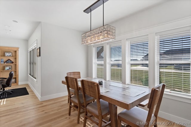 dining space featuring light wood-type flooring