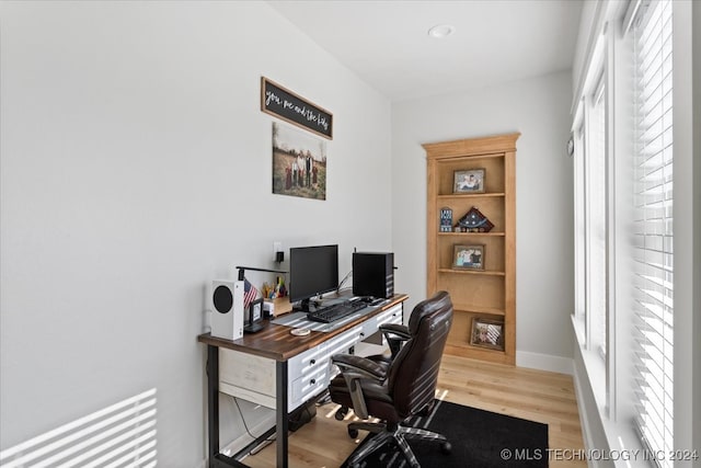 office with light hardwood / wood-style floors