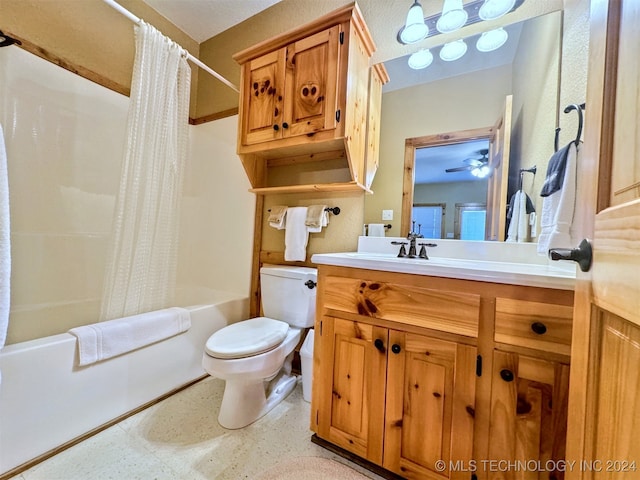 full bathroom with vanity, ceiling fan, toilet, and shower / tub combo