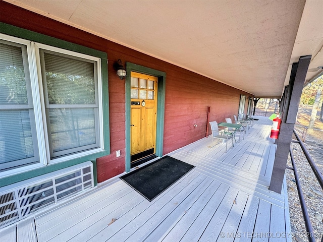 wooden deck featuring radiator heating unit