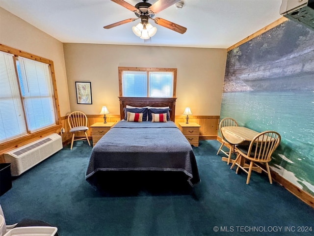 carpeted bedroom featuring a wall mounted air conditioner, ceiling fan, and wooden walls