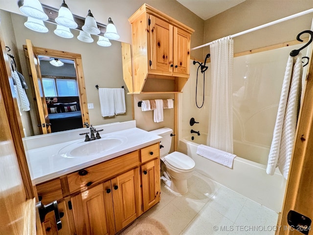 full bathroom featuring toilet, vanity, tile patterned floors, and shower / bathtub combination with curtain