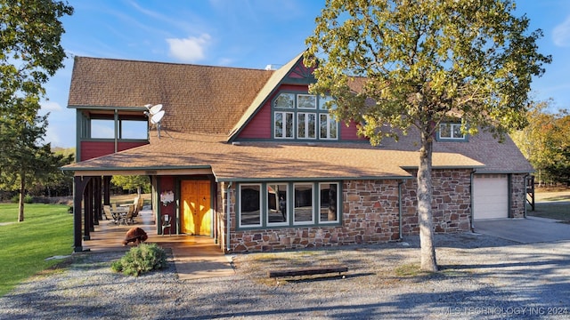 view of front of home with a garage and covered porch