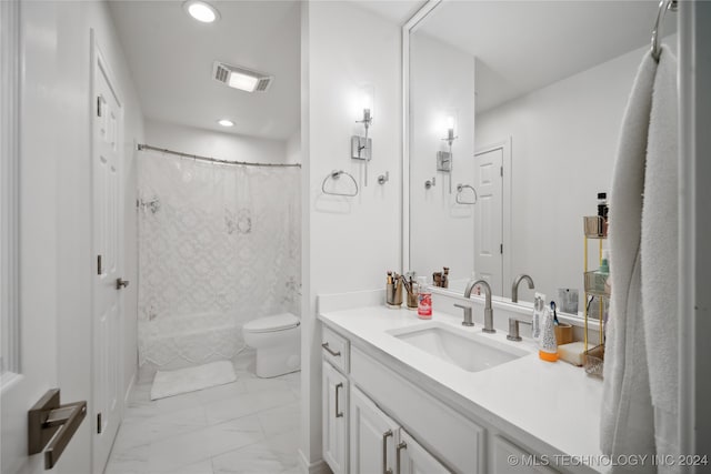 bathroom with vanity, toilet, and curtained shower