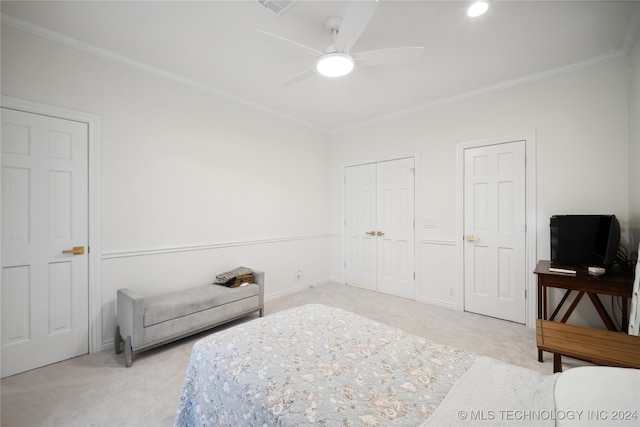 carpeted bedroom with ceiling fan and crown molding