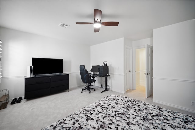 bedroom featuring light carpet and ceiling fan