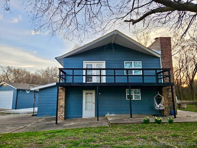 view of front of property featuring a patio area and a deck