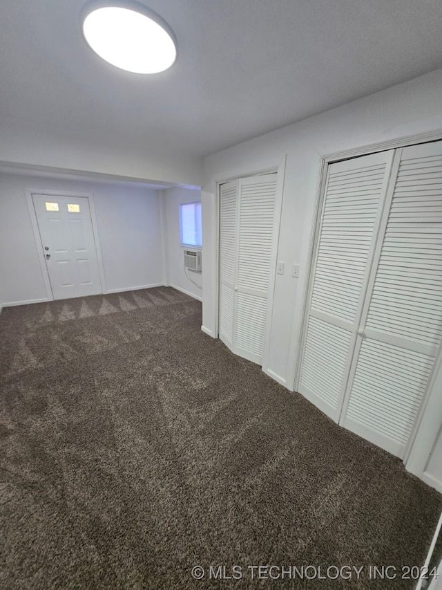 basement with carpet flooring and cooling unit