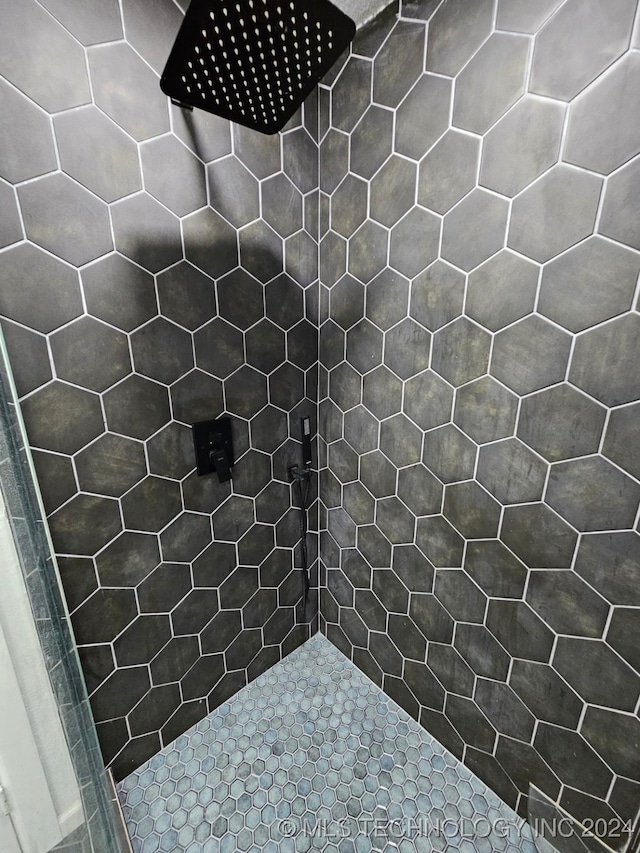 bathroom with tiled shower