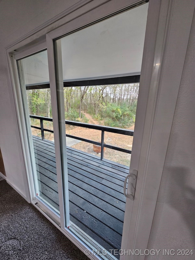 doorway featuring carpet