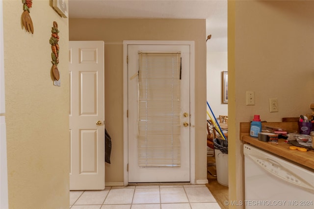 hallway featuring light tile patterned floors