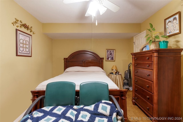 bedroom featuring light carpet and ceiling fan