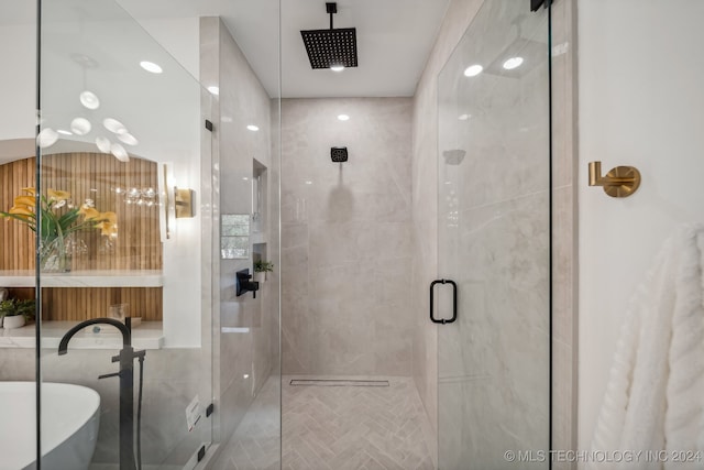 bathroom with a shower with door