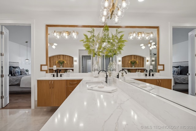 kitchen featuring hanging light fixtures, a notable chandelier, and sink