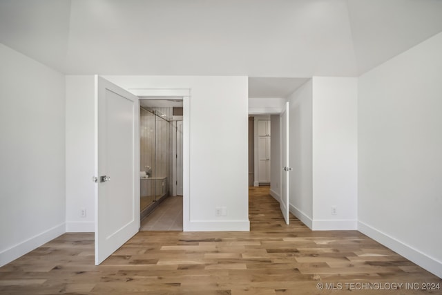 unfurnished bedroom with light wood-type flooring