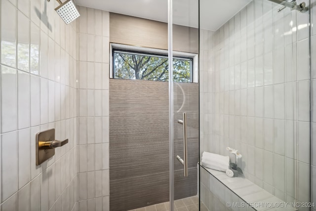 bathroom with tiled shower